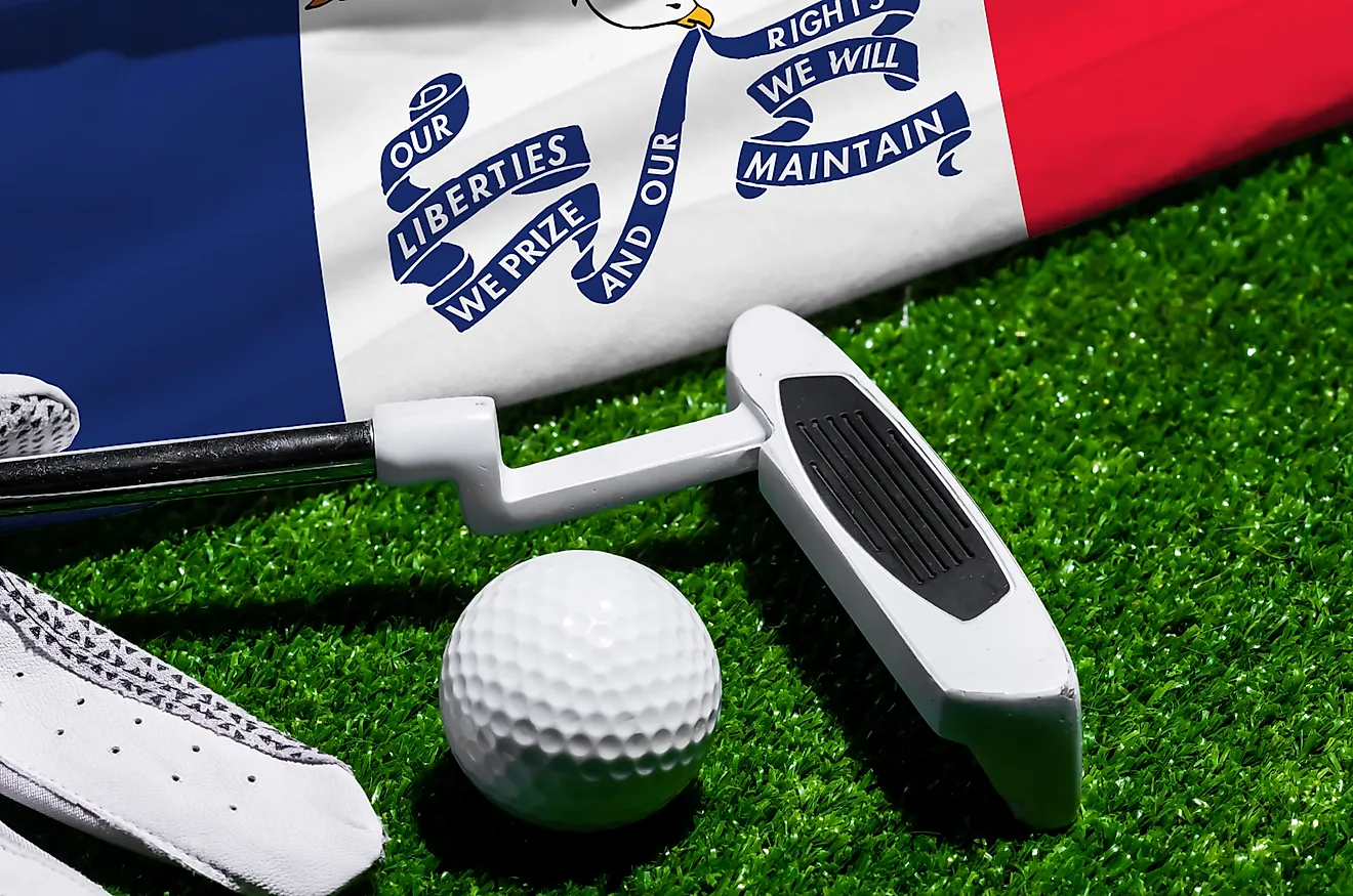 Golf ball, club and flag of Iowa for a golf championship in Iowa. Via Shutterstock / Bermix Studio.