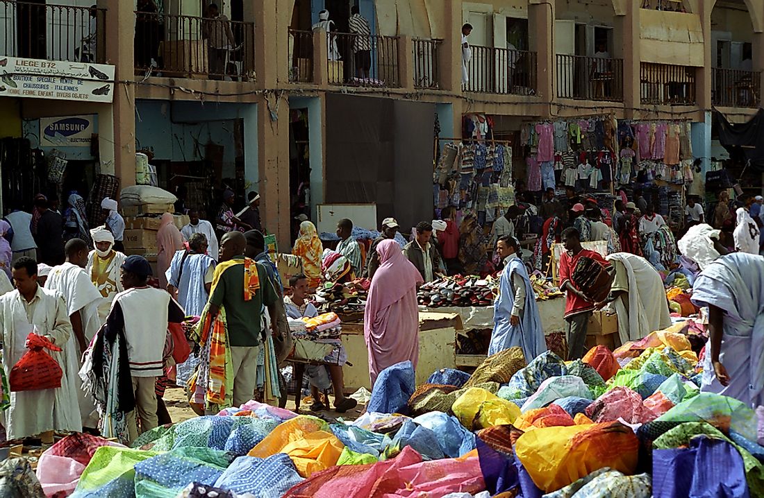 Mauritanians are a market in Nouakchott. Editorial credit: Attila JANDI / Shutterstock.com.