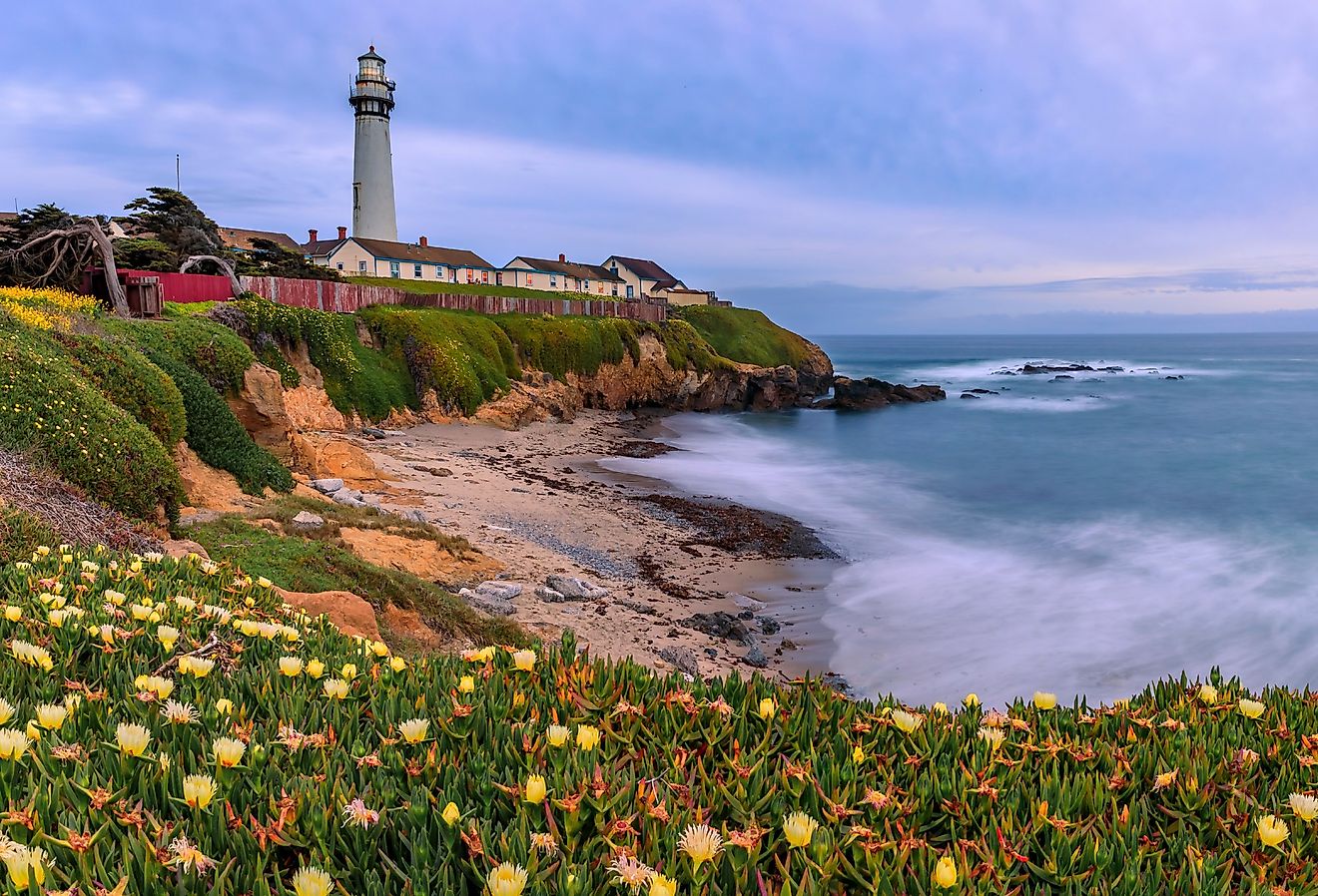 Pastel colors of sunset and silky water, waves crashing on the shore by Pigeon Point Lighthouse, Northern California, Pescadero.