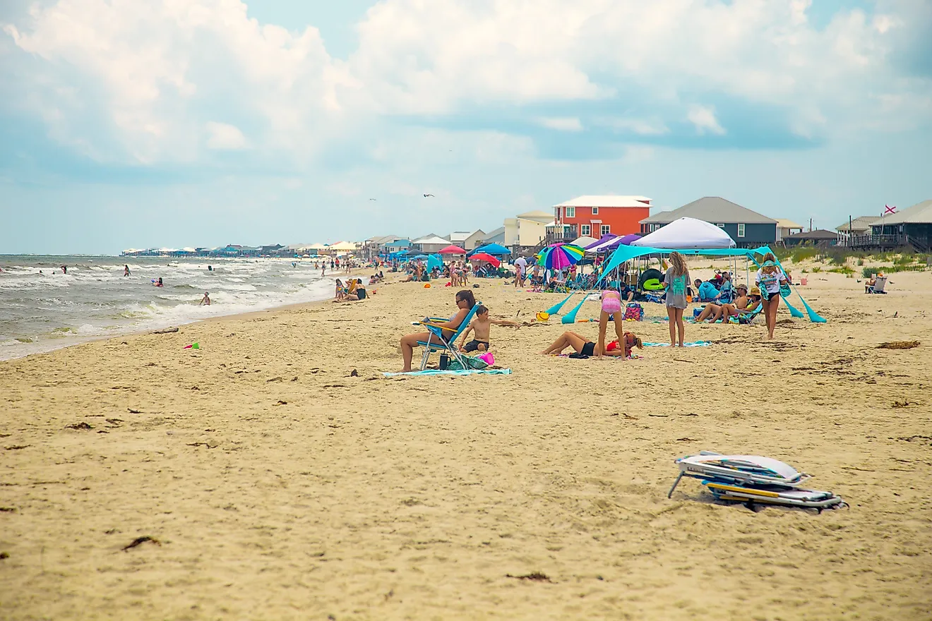 A busy day at the beach in Dauphin Island, Alabama. Editorial credit: HarrisonJeffs / Shutterstock.com.