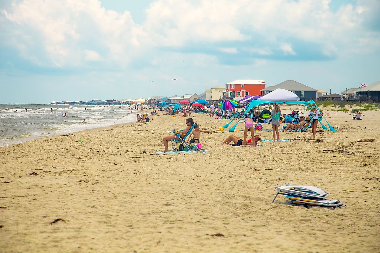 A busy day at the beach in Dauphin Island, Alabama. Editorial credit: HarrisonJeffs / Shutterstock.com.