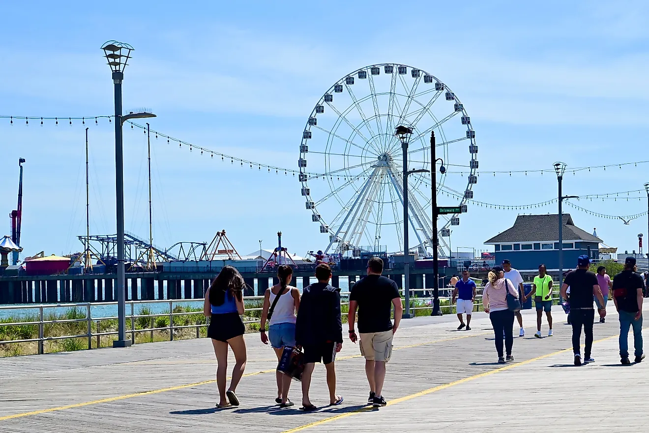 People walking in groups along the Atlantic City Boardwalk, NJ. Editorial credit: edwarda28 / Shutterstock.com
