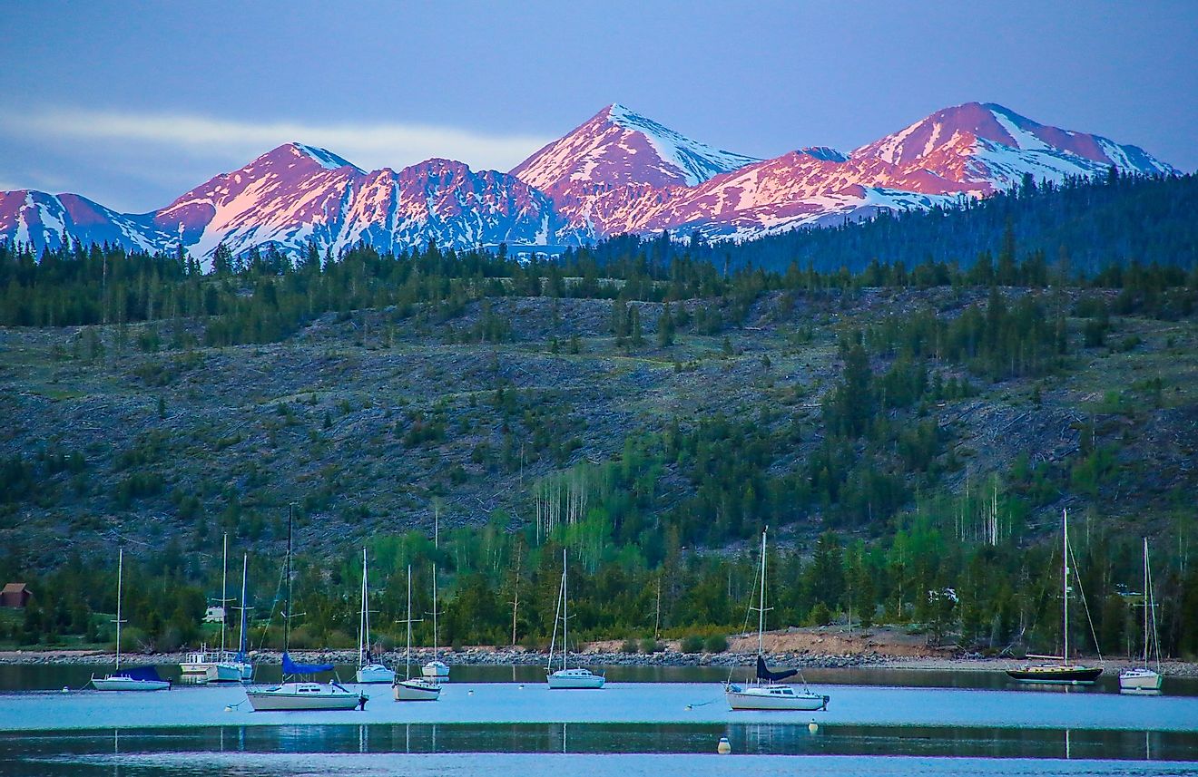 Alpenglow hitting the peaks of Grays and Torreys beyond the Frisco Bay Marina in Frisco, Colorado. 