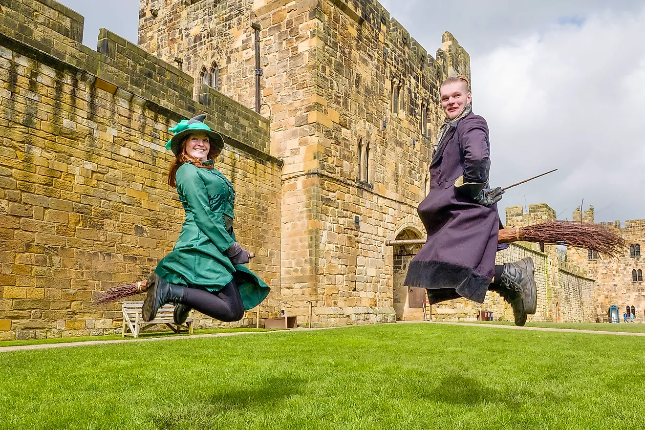 Two participants learn how to ride a broom and play quidditch at the Alnwick Castle. Credit: Bryan Dearsley