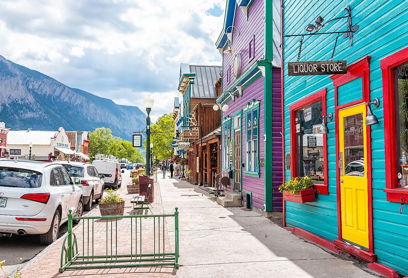 Village houses and stores in downtown Crested Butte, Colorado in summer. Image credit Kristina Blokhin via stock.adobe.com