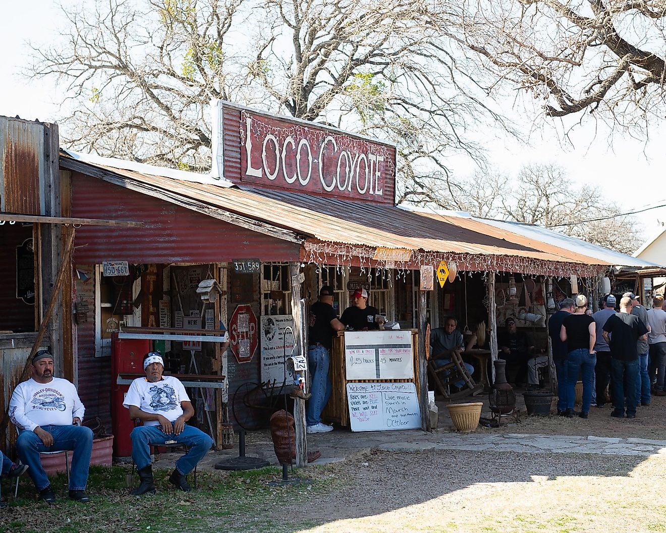 Motorcycles and Biker People at Loco Coyote Bar and Grill In Glen Rose Texas on a Sunny Day
