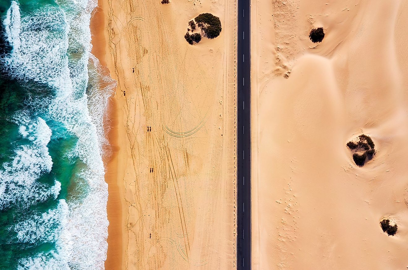 Highway running through the coastal Namib Desert along the Atlantic Ocean in Namibia. Image credit: Lukas Bischoff Photograph/Shutterstock.com