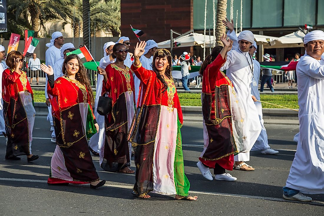 UAE citizens march in a parade in Dubai. Editorial credit: Frankris / Shutterstock.com. 