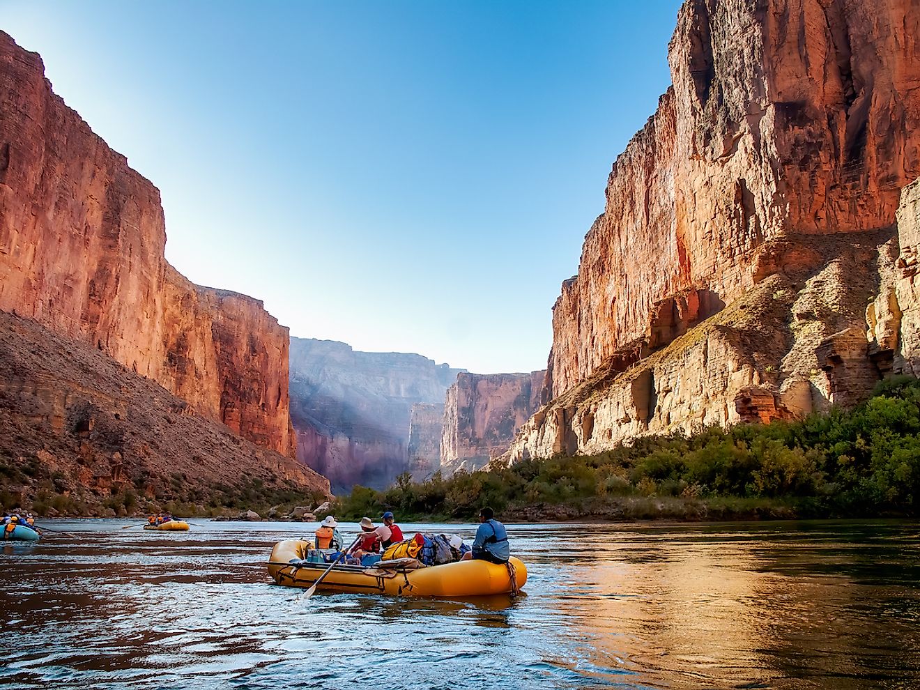 Rafting on The Colorado River in the Gran Canyon at sunrise. Image credit: Jim Mallouk/Shutterstock.com