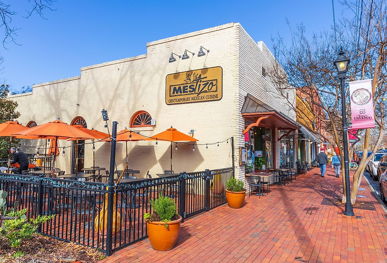Restaurant and people walking on Main Street in downtown Davidson, North Carolina. Image credit Nolichuckyjake via Shutterstock