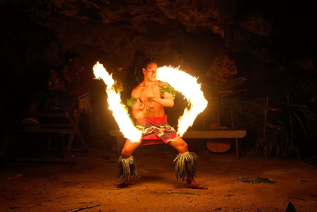 A Tongan man performs a traditional fire dance. Editorial credit: Don Mammoser / Shutterstock.com. 