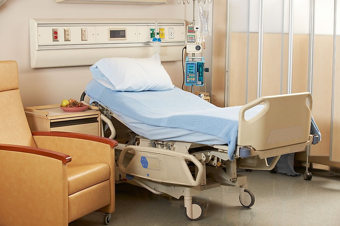 An empty hospital bed in a ward. 