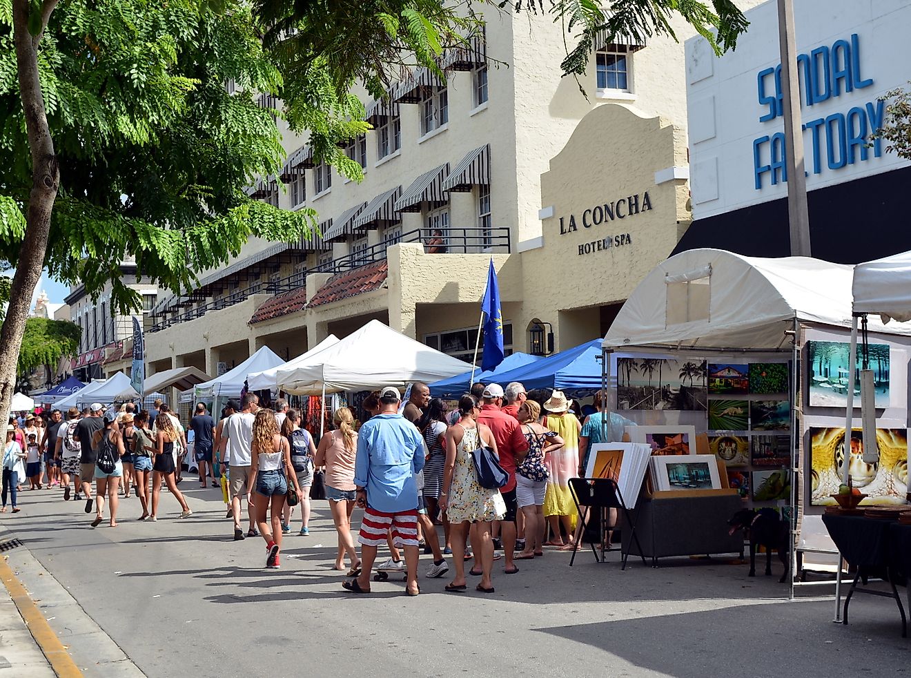 Tourists walking in front of the La Concha Hotel and Spa in Key West.