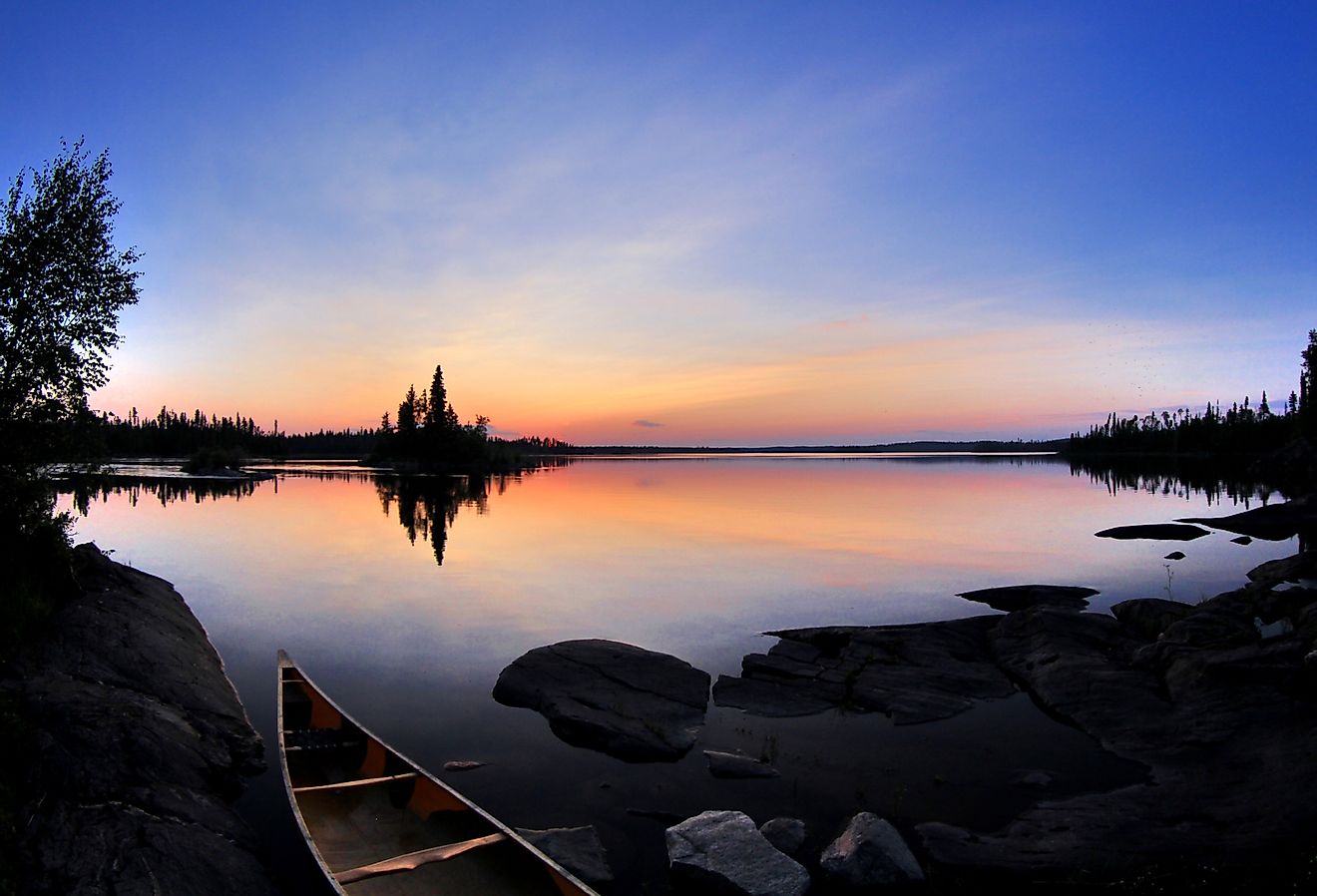Calm summer day in northern Saskatchewan. In the Churchill River system. Image credit Curtis N. via Shutterstock. 