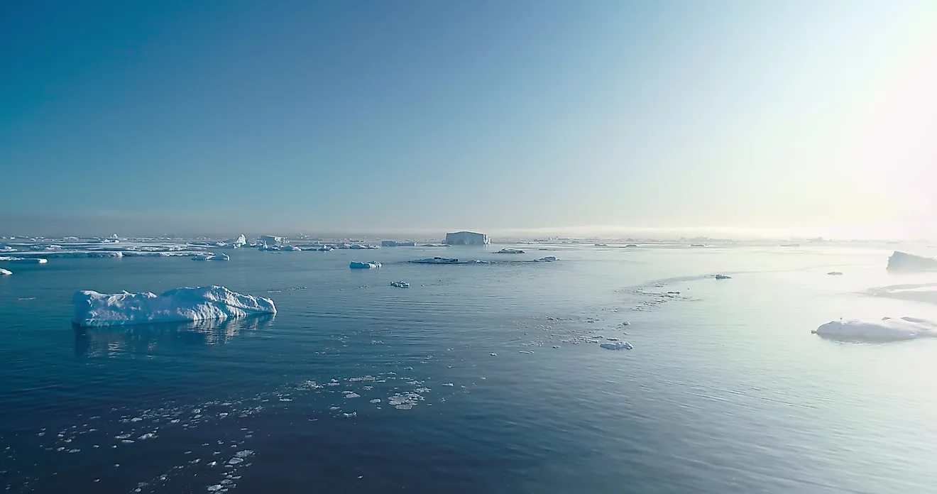 Sunny Antarctica ocean aerial landscape, showcasing ice actively melting. 