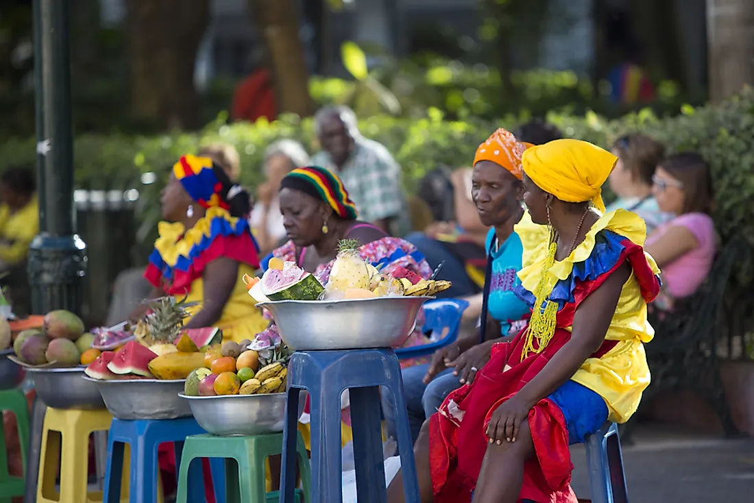 Colombian women sell fruit in the city of Cartagena, Colombia.  Editorial credit: Michel Piccaya / Shutterstock.com.