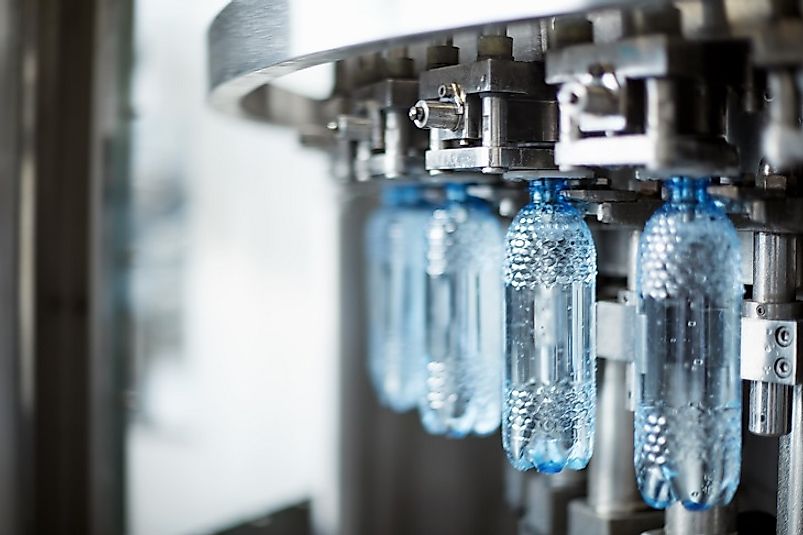 Conveyors move plastic bottles to be filled en masse in large-scale commercial bottled water plants such as this one.