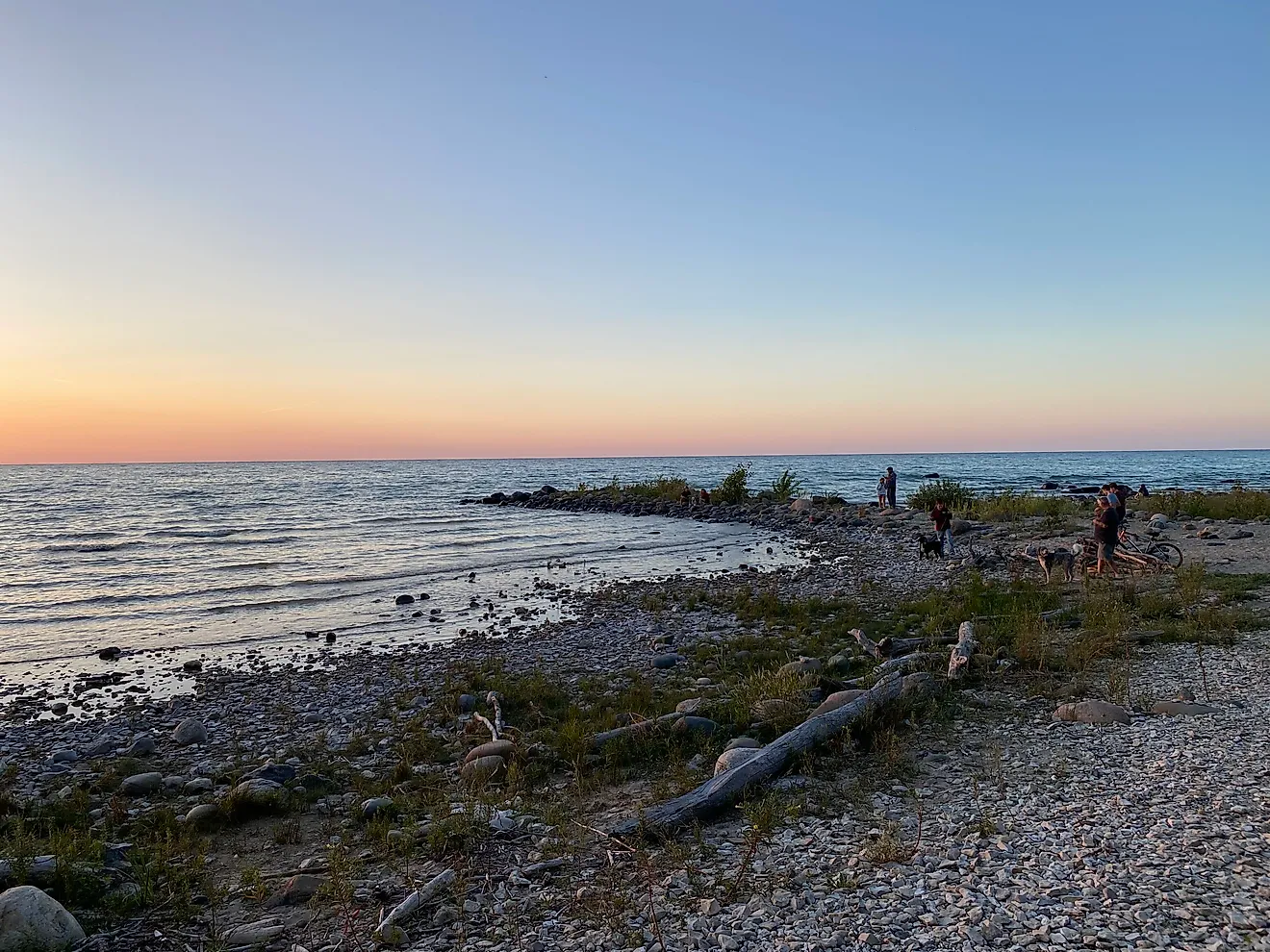 Campers enjoying a pastel sunset from MacGregor Point’s wild Lake Huron beach. CREDIT: Andrew Douglas