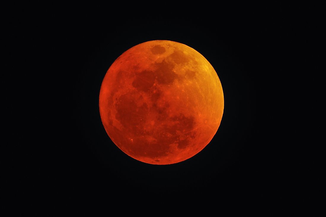 Lunar eclipses look reddish, hence the name Blood Moon. Editorial credit: ChameleonsEye / Shutterstock.com