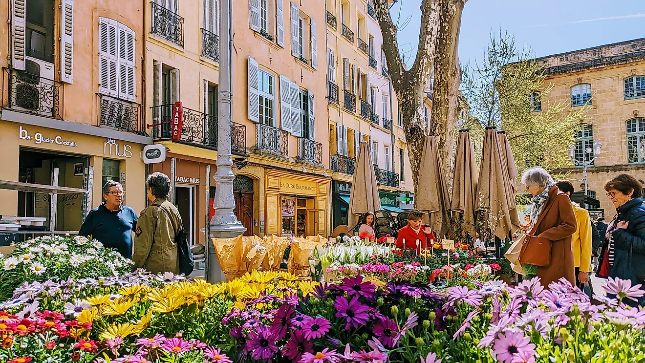  Shoppers browsing vibrant flower market stalls in Aix-en-Provence (Editorial credit: Volker Vornehm / Shutterstock.com) 