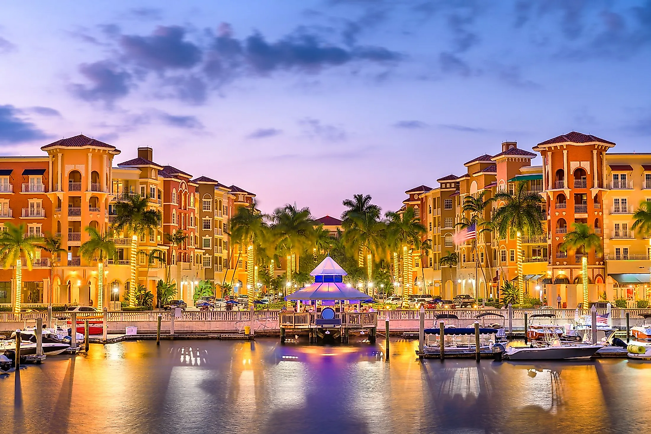 People and boats in a beautiful marina in Naples, Florida, the #1 best town to live in America.