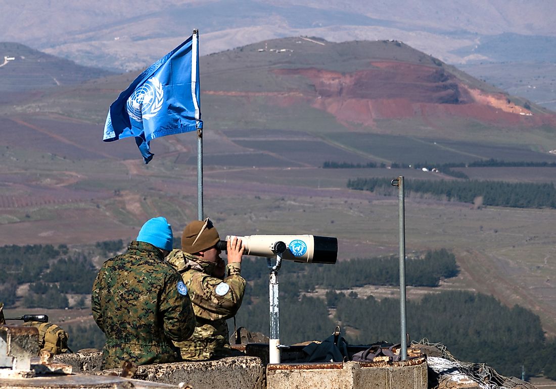 UN peacekeepers observing the Israel-Syria border. Editorial credit: StockStudio / Shutterstock.com