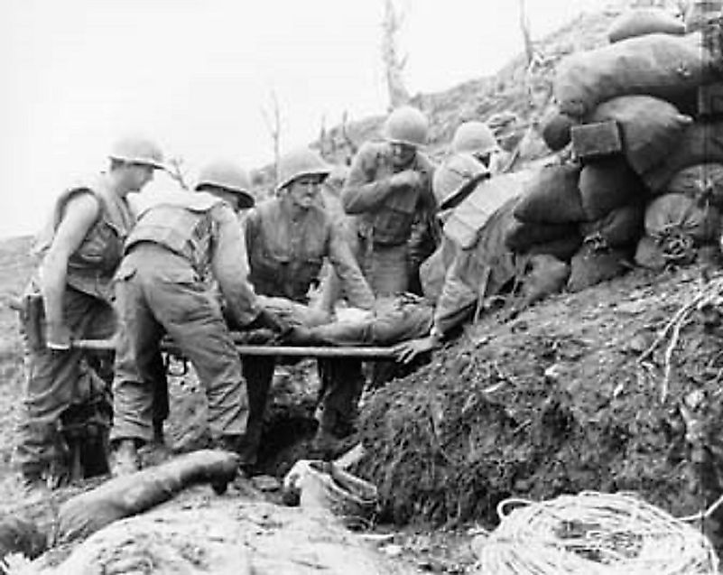 A U.S. Army Infantryman wounded by Communist artillery is being evacuated from Old Baldy to an Army M.A.S.H. medical facility.