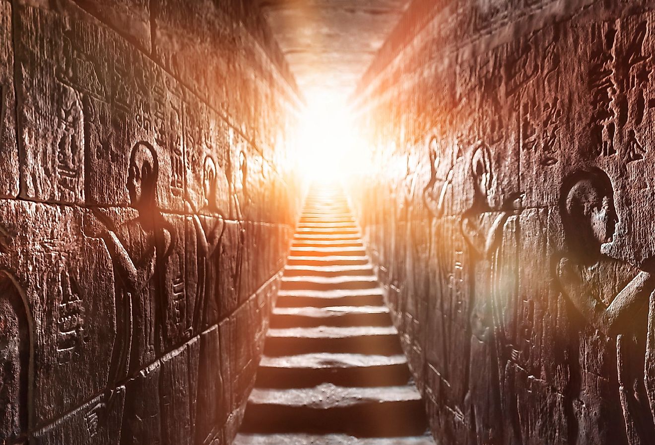 Egypt Edfu temple, Aswan. Passage flanked by two glowing walls full of Egyptian hieroglyphs. Image credit akimov konstantin via shutterstock