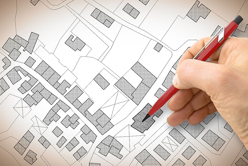 A cartographer works on a cadastral map. 