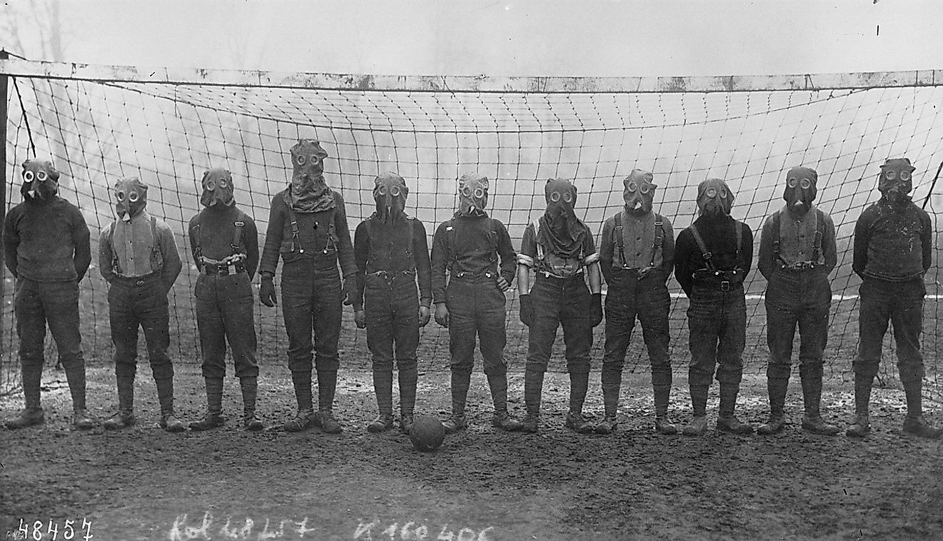 Football team of British soldiers with gas masks, Western front, 1916. Image credit: Agence Rol/Public domain