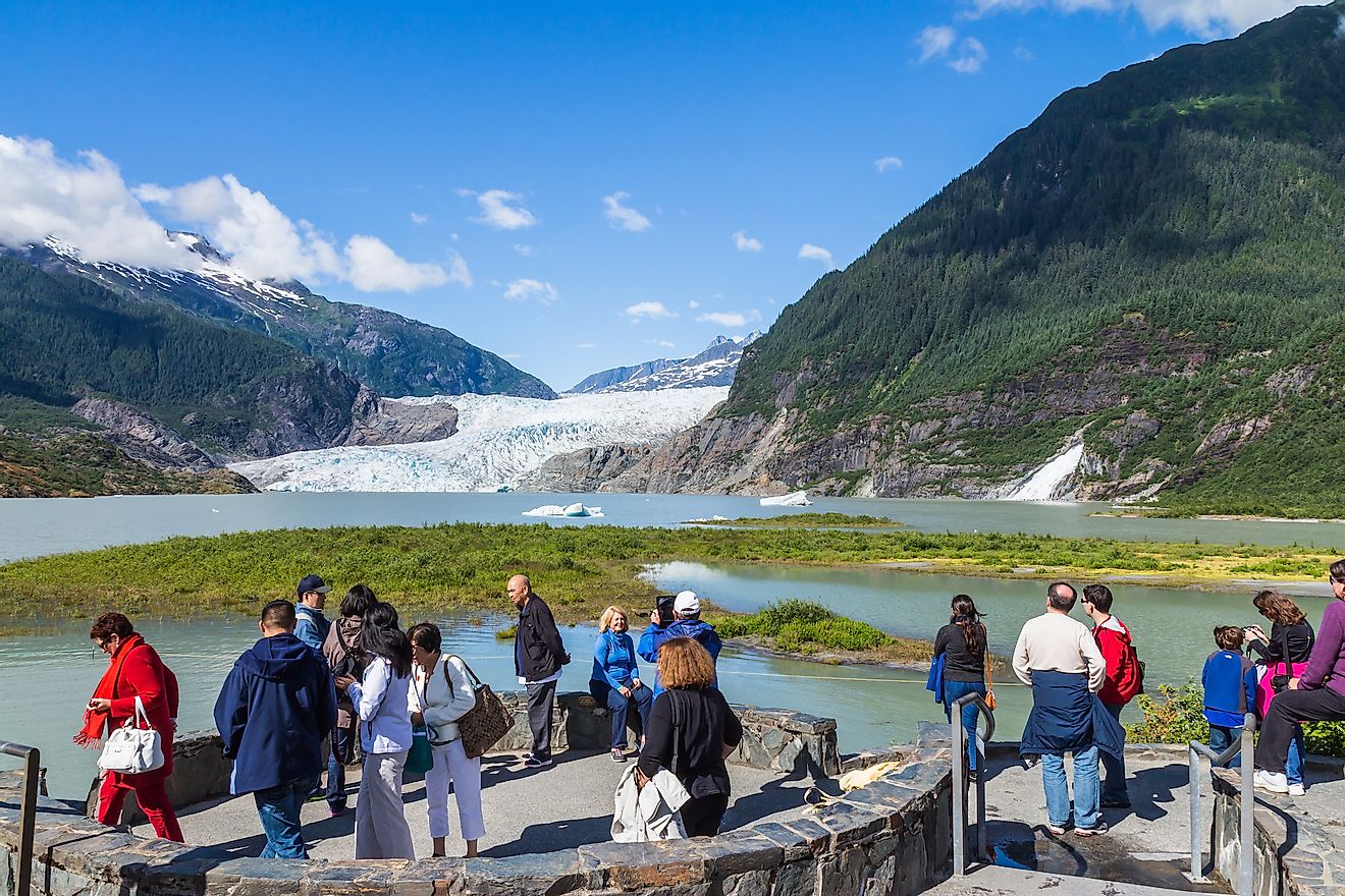 Tourists at the view point of Mendenhall Glacier and Lake in Juneau, Alaska, USA. Editorial credit: fon thachakul / Shutterstock.com