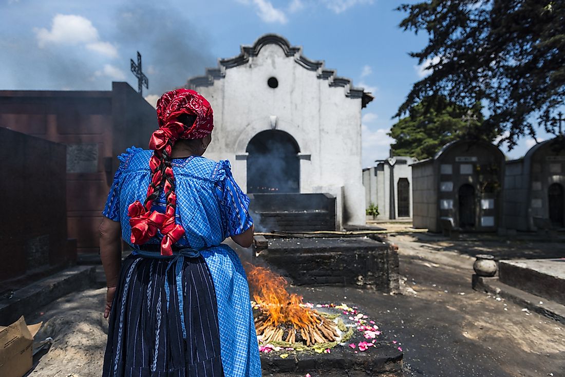 A woman performs a traditional Mayan ceremony in Guatemala. Editorial credit: Peek Creative Collective / Shutterstock.com.