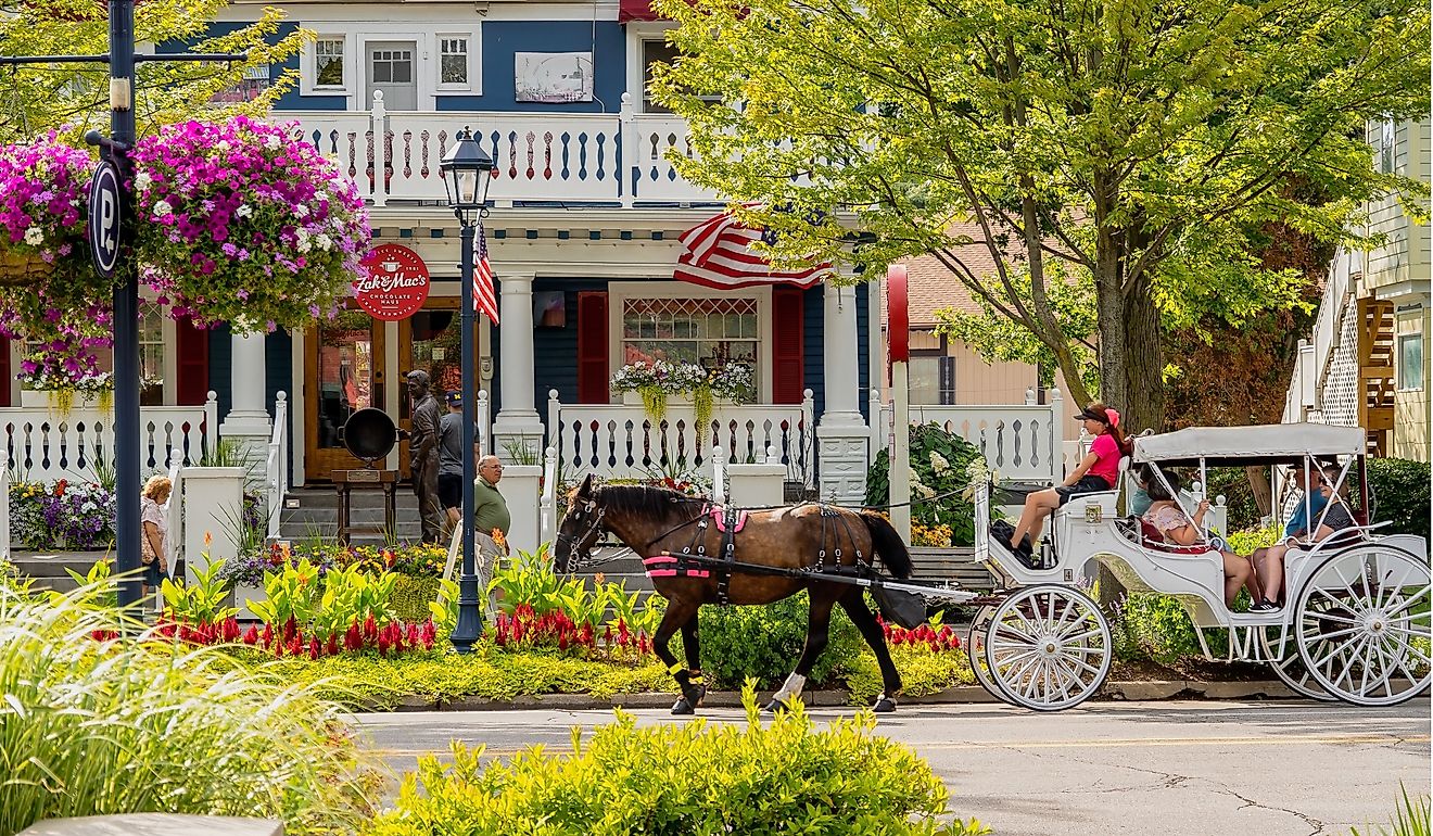 Frankenmuth Michigan, United States. A horse drawn carriage transports tourists in downtown Frankenmuth Michigan. Editorial credit: arthurgphotography / Shutterstock.com