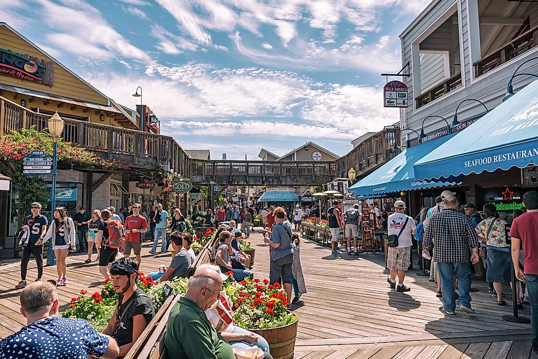 Pedestrians on Pier 39 in San Francisco, California. Editorial credit: Francesco Cantone / Shutterstock.com.