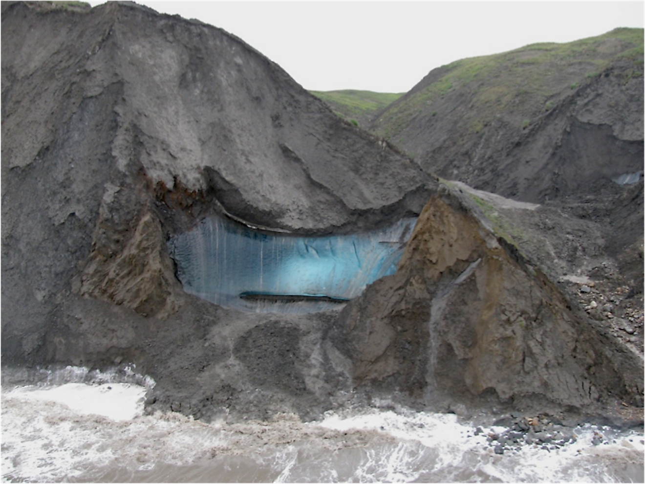 Massive blue ground ice exposure on the north shore of Herschel Island, Yukon, Canada. Image credit: Dave Fox/Wikimedia.org