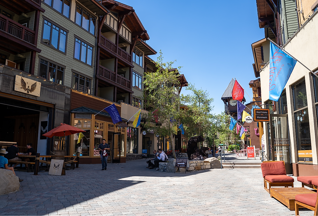 A pedestrian friendly shopping area with restaurants in Mammoth Lakes in the summer. Image credit melissamn via Shutterstock.com