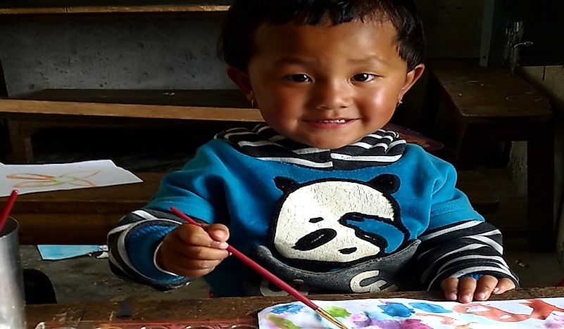 A Nepali child enjoys a painting session conducted by Trek to Teach. Photo credit of Trek to Teach.