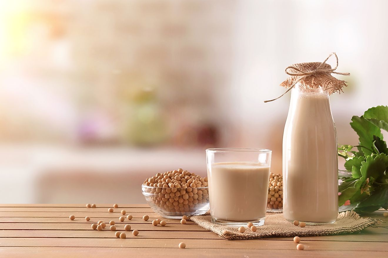 Soy milk and grains on a wooden table
