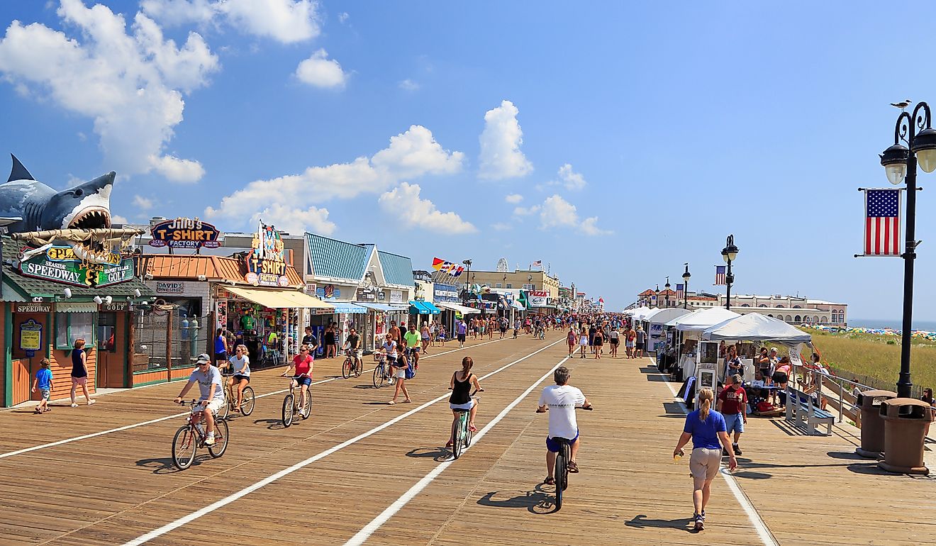 People walking and biking along the boardwalk in Ocean City, New Jersey. Editorial credit: Vlad G / Shutterstock.com 