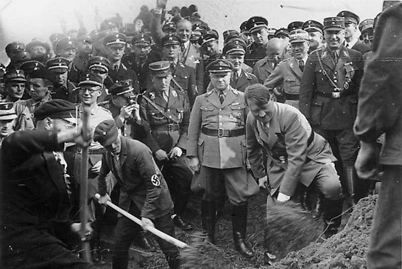 Adolf Hitler taking part in a groundbreaking ceremony for a public works project in 1930s Fascist Germany.