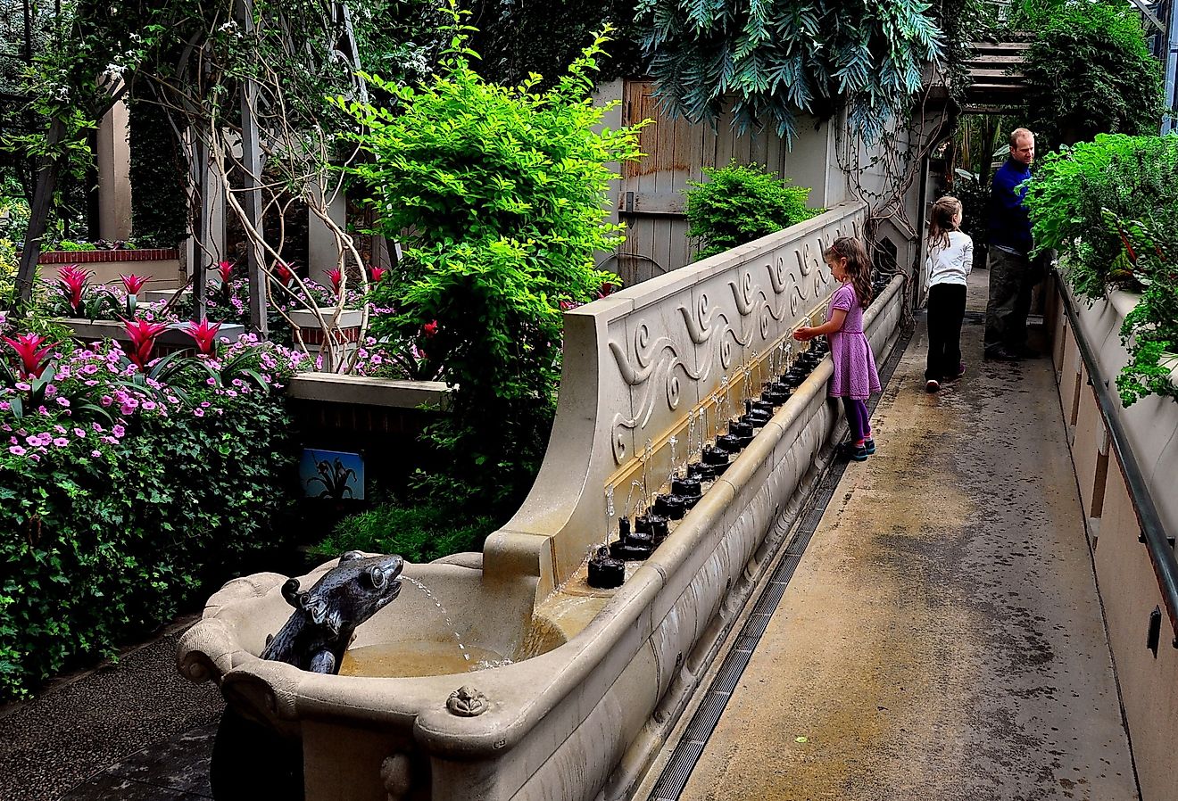 A little girl plays with the imaginative fountains in the Children's Garden at Longwood Gardens in Kennett Square. Image credit LEE SNIDER PHOTO IMAGES via Shutterstock.com.
