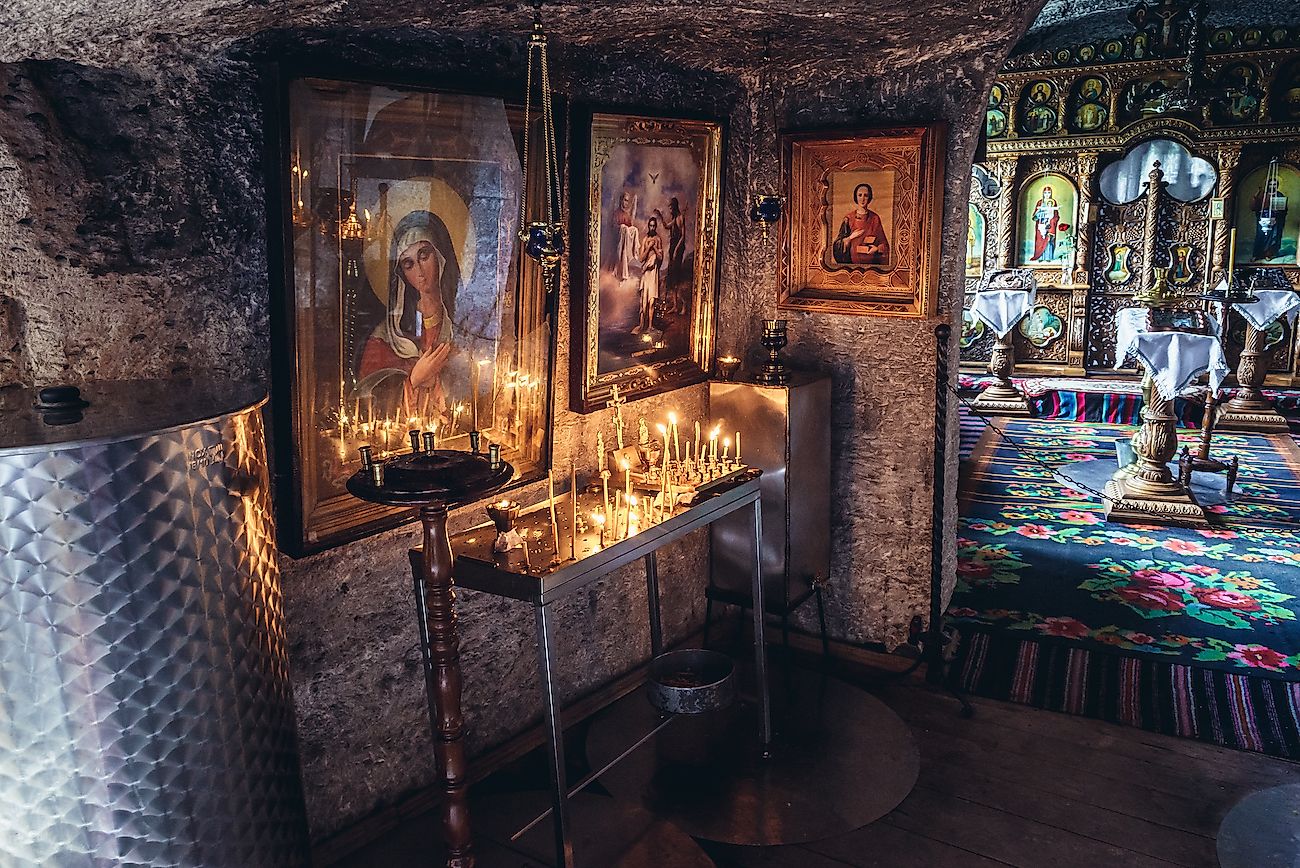 Interior of a cave monastery in Orheiul Vechi natural and historical complex near Trebujeni village. Image credit: Fotokon/Shutterstock.com