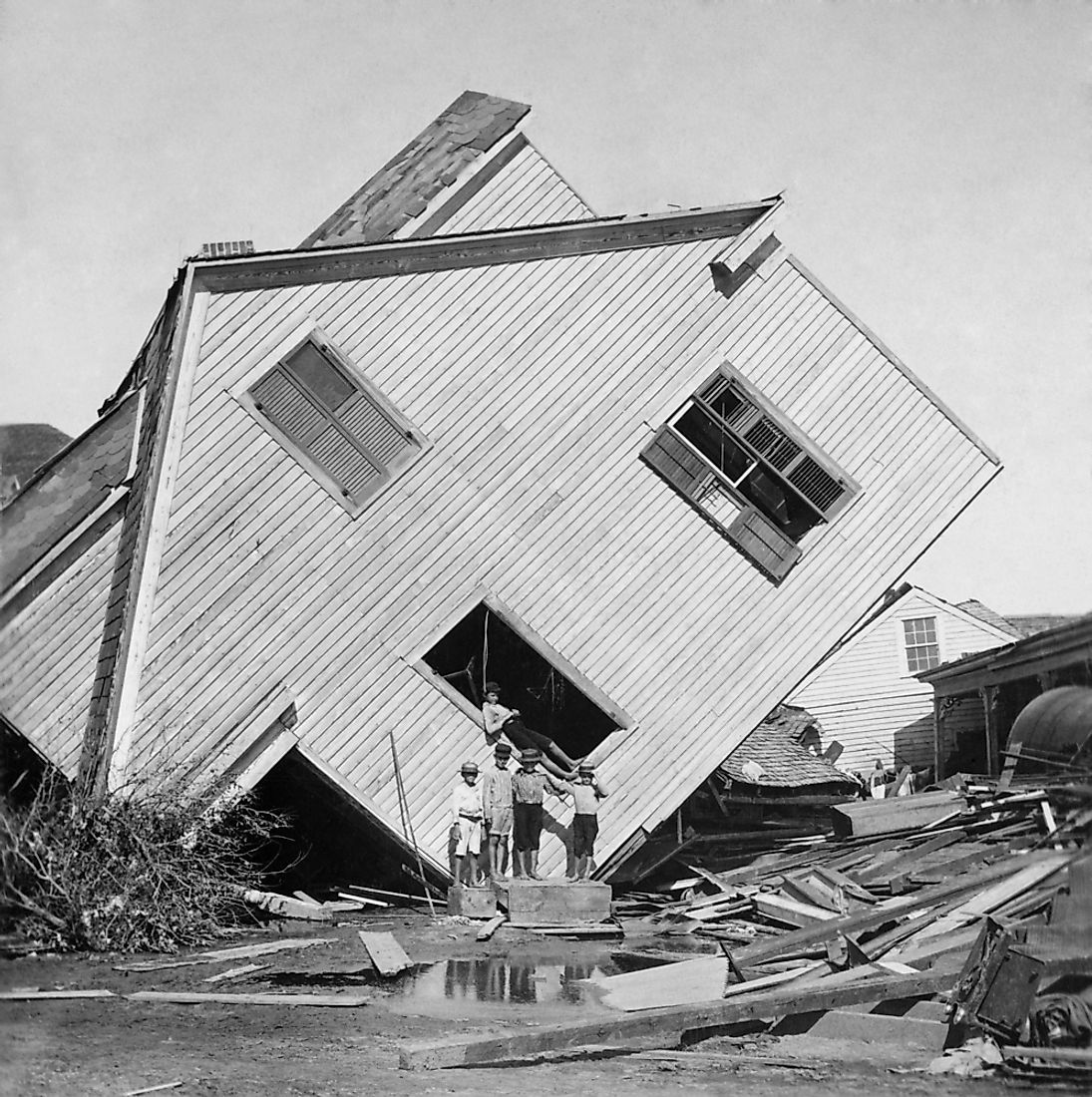 A house turned on its side from the force of the disastrous Galveston Hurricane in 1900. Editorial credit: Everett Historical / Shutterstock.com.