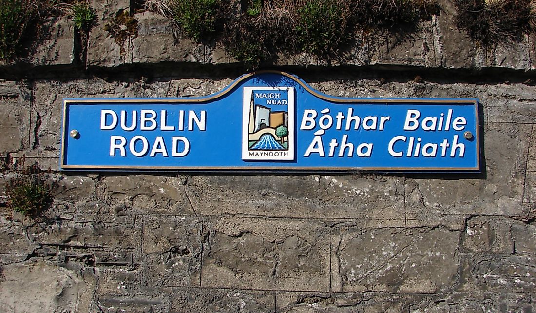 Road sign in English and Irish in Maynooth, Ireland. Editorial credit: CTatiana / Shutterstock.com