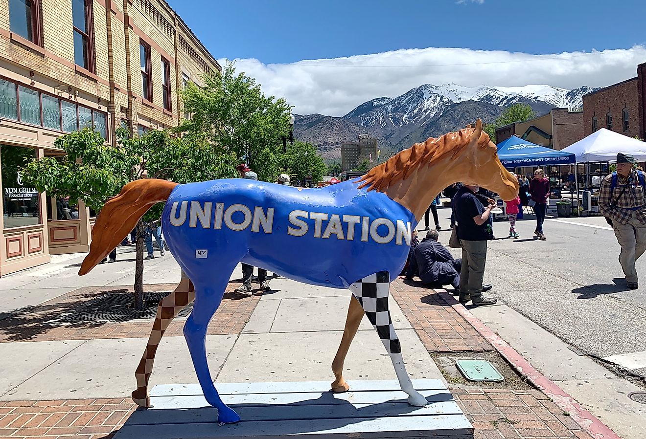 A horse statue painted with union station logo stands on Historic 25th Street in Ogden, Utah. Image credit PureRadiancePhoto via Shutterstock