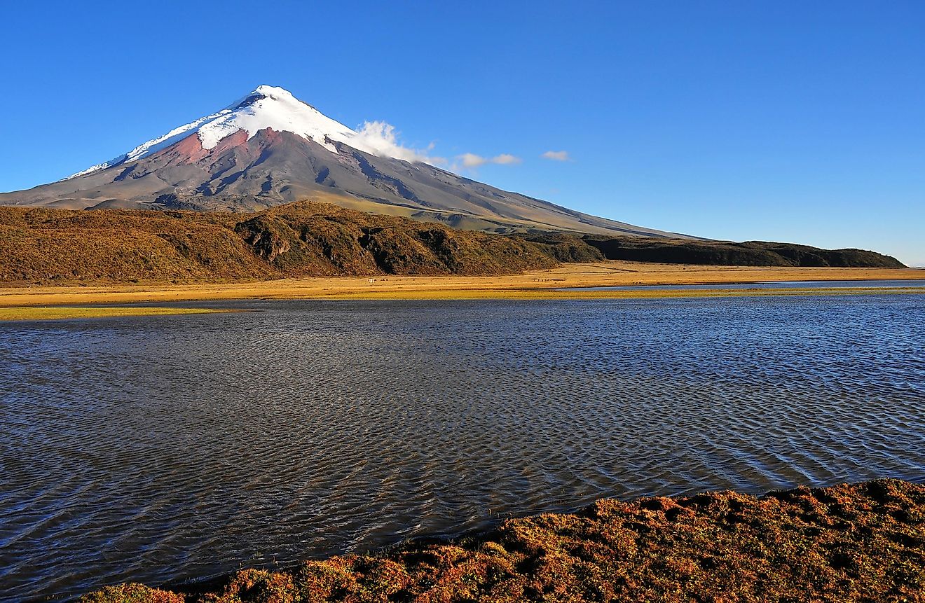 The full force of Cotopaxi, an active stratovolcano in Ecuador, with Laguna de Limpiopungo in the foreground.