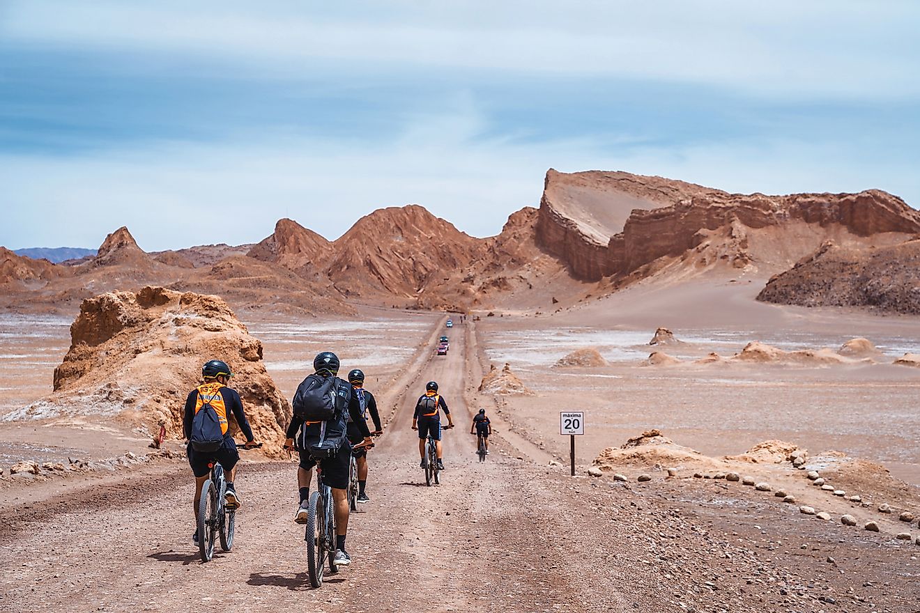 Cyclists exploring the Moon Valley (Spanish: Valle de La Luna ) in the Atacama Desert near San Pedro de Atacama, northern Chile, South America. Image credit: R.M. Nunes/Shutterstock.com 