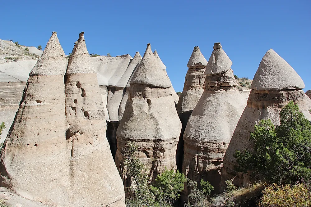 The Tent Rocks layer beige, pink, and gray rock. 