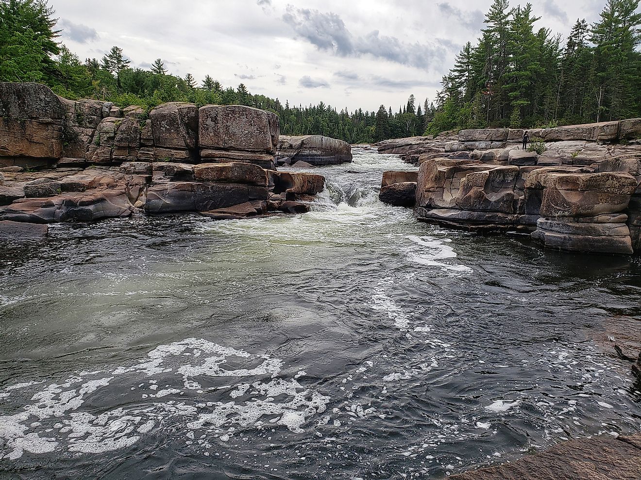 Rushing water at Pabineau Falls, New Brunswick. Image credit: Danhusseyphoto/Shutterstock.com