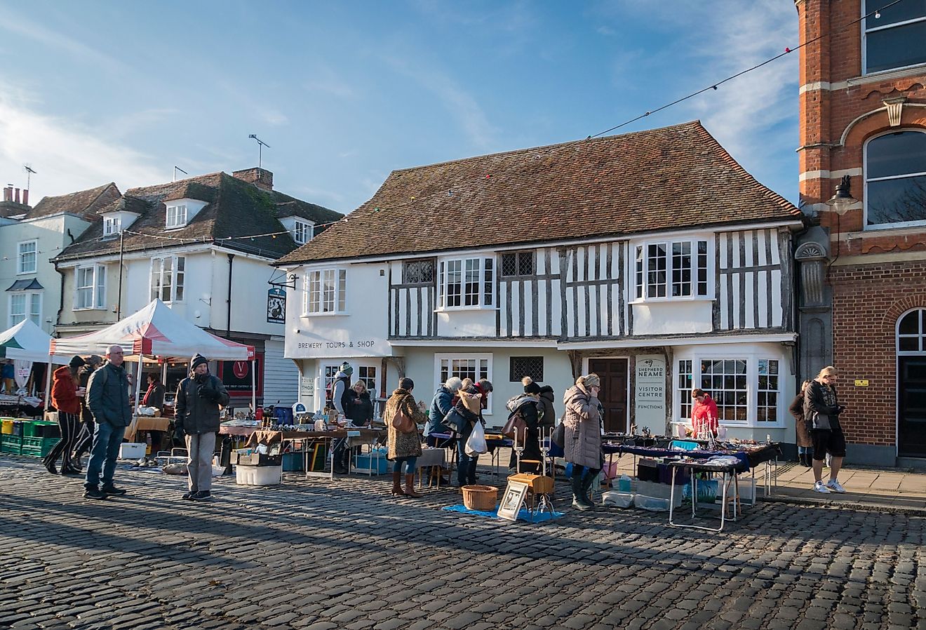 Market stalls in the medieval town of Faversham, Kent, UK. Image credit: Sue Martin via Shutterstock.